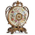 Aesthetic movement porcelain clock giltbronze mounted handpainted peacock and floral enamel decoration eight day time and strike movement early 20th c 21
