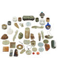 Chinese hardstone and jade articles approximately forty pieces including seven archers rings three snuff bottles four jade belt hooks and assorted hardstone pendants largest 3 12 x 1 12