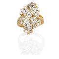14k yellow gold diamond cluster ring bypass of channel and prong set rbc diamonds center conforming diamond spray largest stone approx 20 ct diamonds approx 2 cts tw ca 1985 marked 14k siz