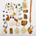 Large colleciton of chinese jade amber etc estate collection of jade earrings discs links earrings and pendants includes gold carnelian mother of pearl nephrite amethyst etc 19th20th c