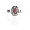 Rubellite tourmaline  diamond 14k white gold ring oval faceted tourmaline approx 12 cts within frame of channel set rbc diamonds approx 40 ct tw ca 2010 size 6 14 36 dwt