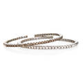 Two diamond 18k white gold sprung bracelets open cuffs of box shaped links on spring steel one set with 25 rbc colorless diamonds one with 25 rbc chocolate diamonds approx 350 cts tw ca 2000