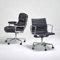 Charles and ray eames herman miller two rolling office chairs timelife and aluminum group zeeland mi 2000s polished aluminum leather casters manufacturers label to timelife timelife