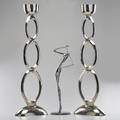 Contemporary figural sculpture and pair of pillar candle holders unmarked 33 12 x 12 x 6