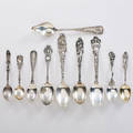 Sterling silver souvenir spoons group of ten in religious and holiday motifs earlymid 20th c easter christmas and halloween all marked longest 6 55 ot