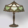 Arts and crafts table lamp with metal overlay shade decorated with stylized leaves usa early 20th c patinated white metal slag glass four sockets marked alpo to finial 26 x 21 14