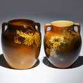 Laura e lindeman sally toohey rookwood two twohandled vases in standard glaze each decorated with daisies cincinnati oh 18901905 both with flame mark and artist cipher taller 5 12 x 5