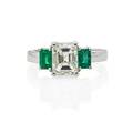 Emerald cut diamond and emerald engagement ring
