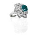 Diamond platinum and chatham emerald pinwheel ring
