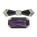 Two art deco platinum brooches with onyx or enamel