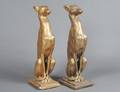 PAIR OF GILT PLASTER FIGURES OF EGYPTIAN DOGS