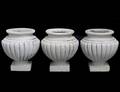 SET OF THREE MOLDED CONCRETE JARDINIERES