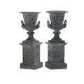 Pair of neoclassical style galvanized steel urns