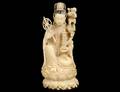 CARVED IVORY FIGURE OF A FEMALE DEITY