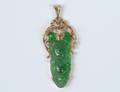 FOURTEEN KARAT GOLD MOUNTED JADE RUYI PENDANT