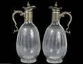 PAIR OF SILVER PLATED MOUNTED GLASS JUGS