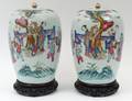 PAIR OF FAMILLE ROSE PORCELAIN JARS AND COVERS