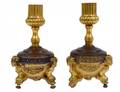 PAIR OF EMPIRE STYLE GILT AND PATINATED METAL