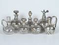 GROUP OF SEVEN STERLING SILVER OVERLAID GLASS BOTTLES A