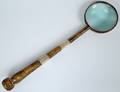 MIDDLE EASTERN BRASS AND MOTHER OF PEARL MAGNIFYING GLA
