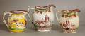 9 GROUP OF THREE STAFFORDSHIRE POTTERY PITCHERS