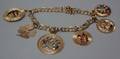 1071 TWO FOURTEEN KARAT GOLD CHARM BRACELETS