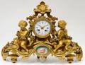 LOUIS XVI STYLE GILT BRONZE AND PORCELAIN MANTEL CLOCK