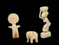 GROUP OF THREE TRIBAL CARVED IVORY STUDIES