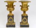 PAIR OF EMPIRE STYLE GILT BRONZE AND MARBLE URNS