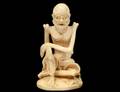 CARVED IVORY FIGURE OF A SKELETON MAN