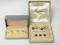 THREE BLACK PEARL AND FOURTEEN KARAT TUXEDO STUDS AND