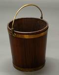 25 GEORGE III STYLE BRASS MOUNTED MAHOGANY PEAT BUCKET