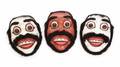 GROUP OF THREE CARVED WOODEN MASKS