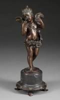 A BRONZE FIGURAL STATUE OF A WINGED FEMALE CHERUB