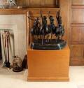 A CAST BRONZE SCULPTURE AFTER FREDERIC REMINGTON