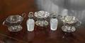 CUT GLASS SALT AND PEPPER TOGETHER WITH THREE RETICULATED STERLING BOWLS