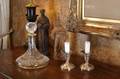 TWO CARVED WOODEN SANTOS STATUETTES DECANTER AND CANDLESTICKS