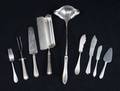 AN ASSORTED GROUP OF STERLING AND SILVER PLATED FLATWARE