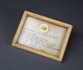 GRAIN OF RICE WITH WAR BOND INSCRIPTION