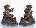 PAIR OF PATINATED BRONZE FIGURES OF PUTTI