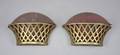 A PAIR OF BRONZE BASKET WALL POCKETS