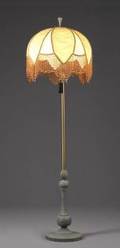 A VICTORIAN STYLE PATINATED METAL BASE FLOOR LAMP