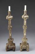A PAIR OF PARCELSILVERED AND GILTWOOD ALTAR CAND