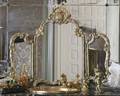 A ROCOCO STYLE THREE PANEL VANITY MIRROR