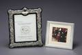 A BAROQUE STYLE SILVER PLATED FRAME