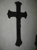 A WOOD AND PATINATEDMETAL CRUCIFIX