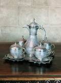 AN INDIAN PARCELGILT SILVER TEA SET