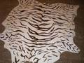 A FAUX ZEBRAPRINTED HIDE RUG