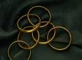 THREE GILT ELASTIC BRACELET PAIRS