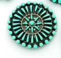 A TURQUOISE STONE BROOCH